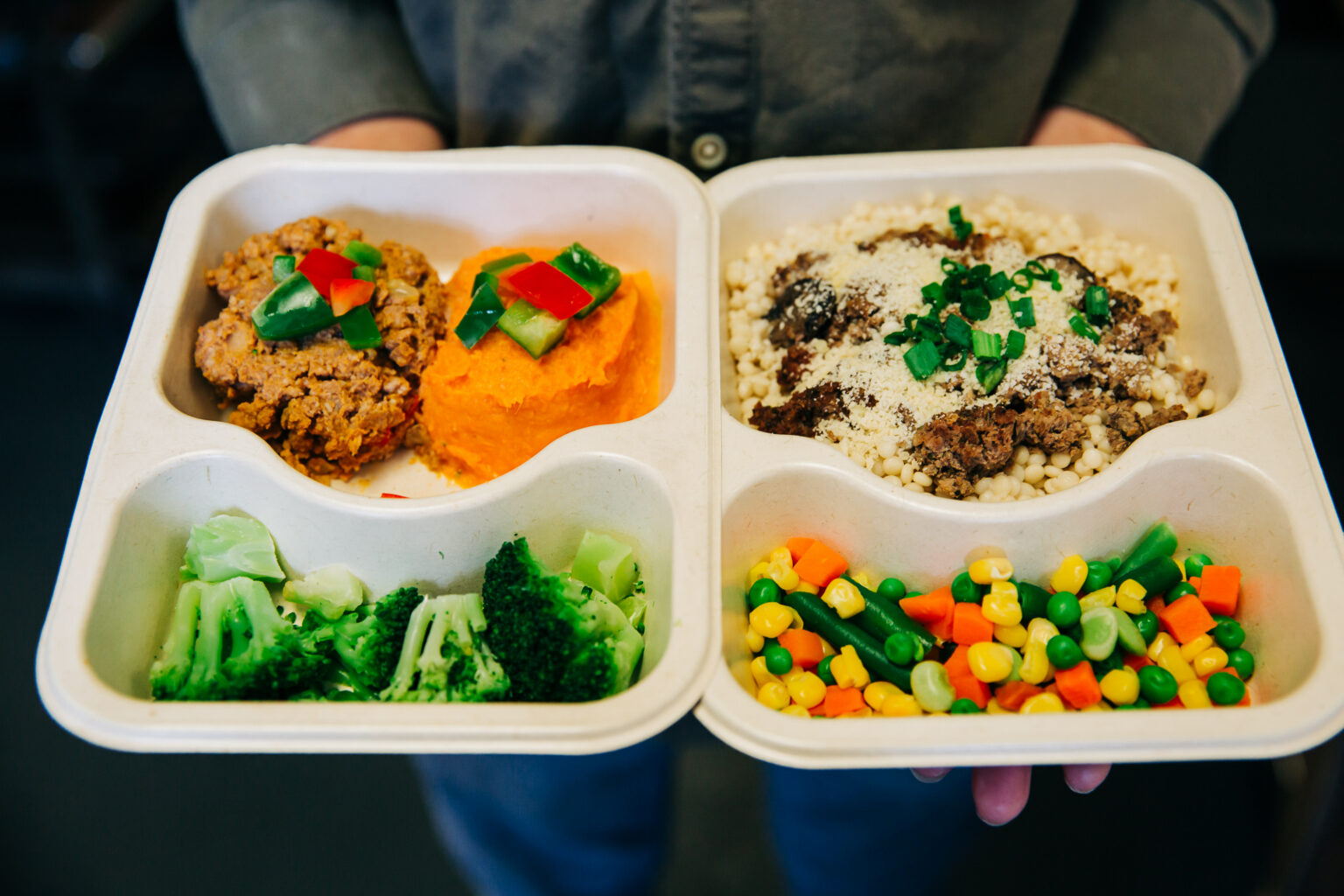 Meal tray in hands.