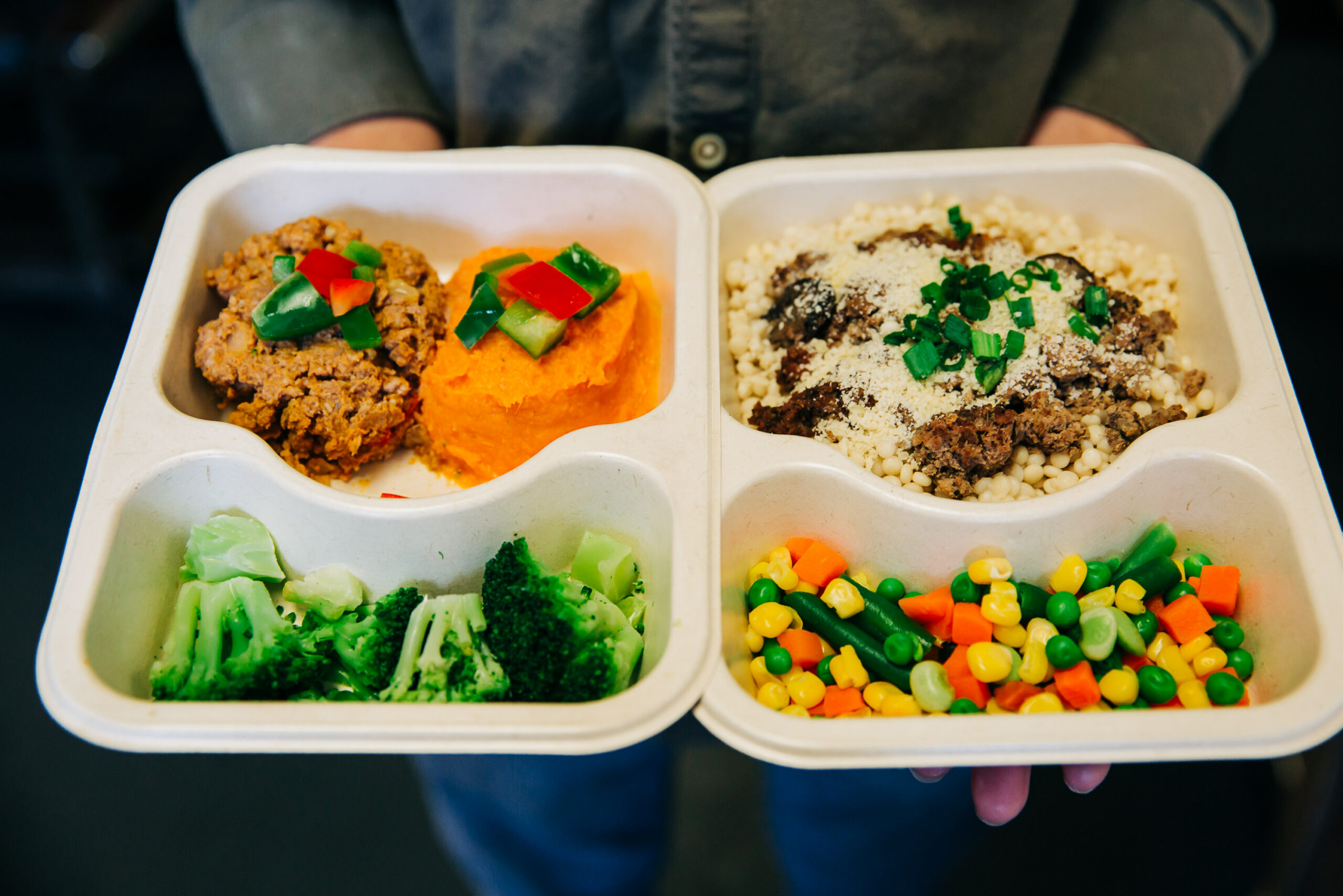 Meal tray in hands.